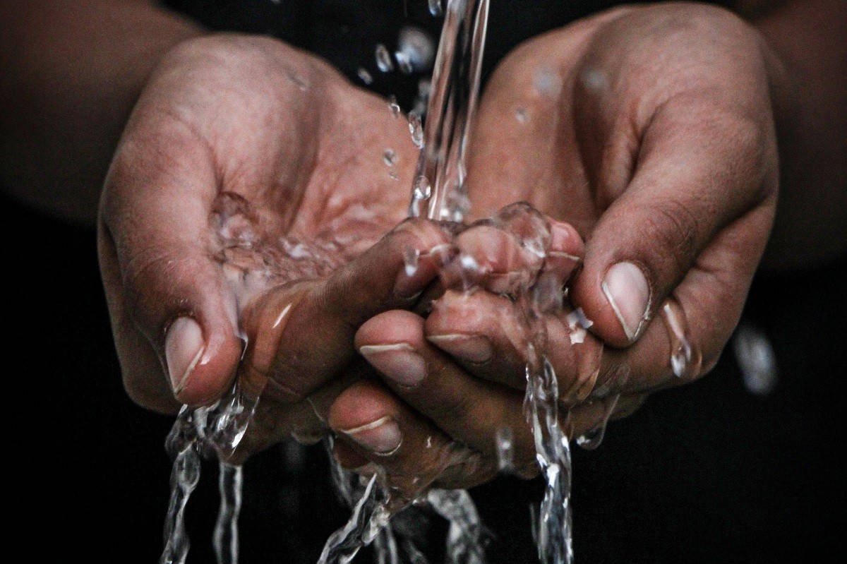 water through hands