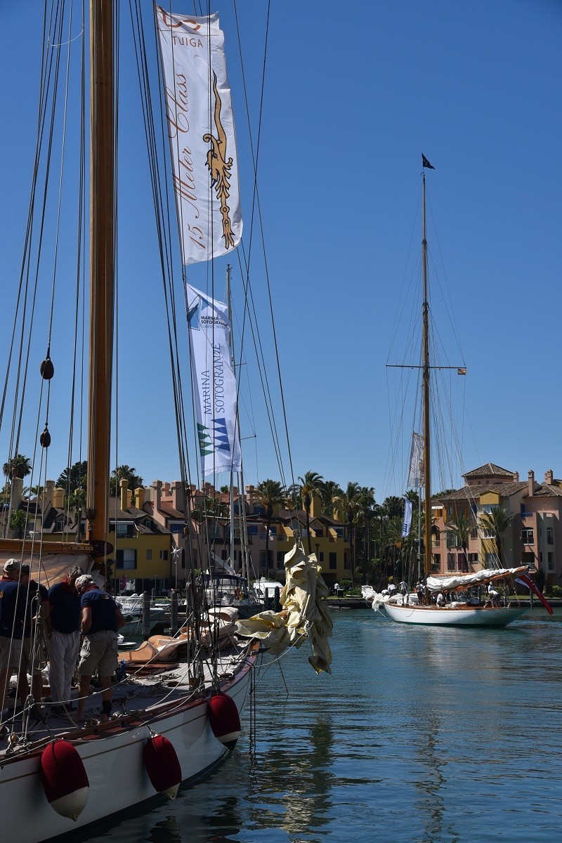 classic sailing ship lies in the harbor with the water of Pineo